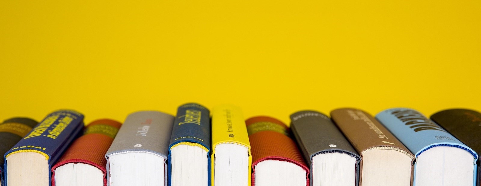 book spines with yellow background